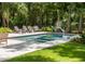 Inviting backyard pool with lounge chairs and lush landscaping, perfect for outdoor relaxation at 441 Elfes Field Ln, Charleston, SC 29492
