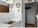 Clean bathroom features vintage hardware and decor with a large wall mirror at 4428 Maple Ridge Rd, Walterboro, SC 29488