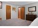 Clean bedroom interior with full bed, dark wood dresser and attached mirror at 4428 Maple Ridge Rd, Walterboro, SC 29488