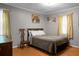 Classic bedroom setting with a full bed and hardwood floors at 4428 Maple Ridge Rd, Walterboro, SC 29488