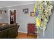 Entryway with hardwood floors, grey walls, and visible living room and kitchen areas at 4428 Maple Ridge Rd, Walterboro, SC 29488