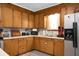 A kitchen featuring light wood cabinets, neutral countertops, and stainless steel appliances at 4428 Maple Ridge Rd, Walterboro, SC 29488