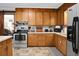A well-organized kitchen featuring white appliances, wooden cabinets and countertops at 4428 Maple Ridge Rd, Walterboro, SC 29488
