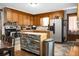 Well-lit kitchen featuring wooden cabinets, modern appliances, and a custom center island at 4428 Maple Ridge Rd, Walterboro, SC 29488