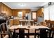 Charming kitchen with light wood cabinets, an island, modern appliances, and a dining table at 4428 Maple Ridge Rd, Walterboro, SC 29488