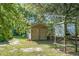 Outbuilding flanked by greenery, offering a secluded and tranquil setting at 4428 Maple Ridge Rd, Walterboro, SC 29488