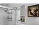 Bright shower space with open medicine cabinet, white tiles and shower caddy at 4428 Maple Ridge Rd, Walterboro, SC 29488