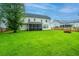 Large, well-maintained backyard with a screened porch and a wooden fence surrounding the property at 468 Maple Oak Ln, Charleston, SC 29414