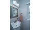 Cozy bathroom with a window bringing in natural light and a sink with storage underneath at 468 Maple Oak Ln, Charleston, SC 29414