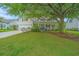 Charming two-story home with a welcoming front porch and a well-manicured lawn at 468 Maple Oak Ln, Charleston, SC 29414