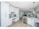 Open kitchen with white cabinetry, stainless steel appliances, and seamless flow to the living space at 468 Maple Oak Ln, Charleston, SC 29414