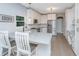 Bright kitchen featuring white cabinets, quartz countertops, stainless steel appliances and eat-in bar at 468 Maple Oak Ln, Charleston, SC 29414