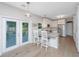 Modern kitchen with island seating, stainless appliances, and access to the outdoor area at 468 Maple Oak Ln, Charleston, SC 29414