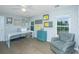 Well-lit office space with a large desk, ample storage, and a cozy chair at 468 Maple Oak Ln, Charleston, SC 29414