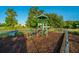 Community playground with modern equipment and a safe, wood-chip ground cover at 468 Maple Oak Ln, Charleston, SC 29414