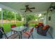 Inviting screened porch furnished with comfortable seating and a ceiling fan for outdoor relaxation at 468 Maple Oak Ln, Charleston, SC 29414