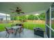 Relaxing screened porch, perfect for outdoor entertainment with green backyard views at 468 Maple Oak Ln, Charleston, SC 29414