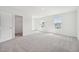 Bright, airy bedroom with plush carpet, two windows, and closet with shelving at 493 Colchester Court Ct, Moncks Corner, SC 29461