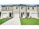 New townhomes feature a classic design with attached garages and professionally landscaped yards at 493 Colchester Court Ct, Moncks Corner, SC 29461