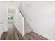 Entryway with staircase featuring plank floors, white walls, and a view into the living area at 493 Colchester Court Ct, Moncks Corner, SC 29461