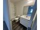 A clean bathroom features a tub/shower combo, white vanity, and dark floors, offering a modern and functional design at 495 Colchester Ct, Moncks Corner, SC 29461
