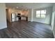 Open-concept living space with wood floors and stainless steel appliances at 495 Colchester Ct, Moncks Corner, SC 29461