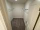 Functional walk-in closet with wire shelving, plush carpet, and neutral walls at 495 Colchester Ct, Moncks Corner, SC 29461