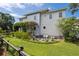 Expansive backyard featuring a stylish fire pit area and lush landscaping at 5017 W Liberty Park Cir, North Charleston, SC 29405