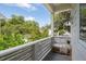 Covered balcony overlooking lush green trees and a blue sky at 5017 W Liberty Park Cir, North Charleston, SC 29405
