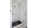 Modern bathroom featuring a glass shower with black and white tiling at 5017 W Liberty Park Cir, North Charleston, SC 29405