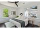 Bright and airy bedroom with three windows showcasing the green foliage outside at 5017 W Liberty Park Cir, North Charleston, SC 29405