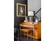 Hallway featuring a piano, artwork, and hardwood floors, creating a cozy and sophisticated atmosphere at 5017 W Liberty Park Cir, North Charleston, SC 29405