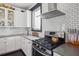 Bright, updated kitchen featuring stainless steel appliances, ample counter space, and subway tile backsplash at 5017 W Liberty Park Cir, North Charleston, SC 29405