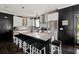 Bright kitchen features subway tile backsplash, stainless steel appliances and a large island with seating at 5017 W Liberty Park Cir, North Charleston, SC 29405