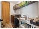 A practical laundry room with shelving, modern appliances, and space for a sewing machine at 5017 W Liberty Park Cir, North Charleston, SC 29405