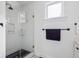 Modern shower with glass door, subway tile, and black accents at 5017 W Liberty Park Cir, North Charleston, SC 29405