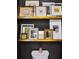 Toilet room features floating shelves displaying framed artwork and a dark accent wall at 5017 W Liberty Park Cir, North Charleston, SC 29405