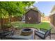 Secluded fire pit with seating, ideal for gatherings and outdoor entertainment in backyard at 5110 Hyde Park Village Ln, North Charleston, SC 29405