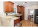 Cozy kitchen with wooden cabinets, granite countertops, and stainless steel appliances at 5110 Hyde Park Village Ln, North Charleston, SC 29405