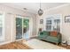 Bright living room with hardwood floors, and sliding glass doors leading to an outdoor space at 5110 Hyde Park Village Ln, North Charleston, SC 29405