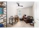 Office with carpet floors, desk and chair, brown leather chair and ottoman, and bookshelf at 5110 Hyde Park Village Ln, North Charleston, SC 29405
