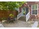 Cozy patio with outdoor seating and a small table, perfect for relaxing or enjoying meals at 5110 Hyde Park Village Ln, North Charleston, SC 29405
