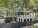Back exterior view featuring a screened porch and backyard at 512 Whilden St, Mount Pleasant, SC 29464