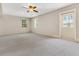 Spacious basement with neutral carpet and a ceiling fan provides a blank canvas for various recreational or storage needs at 512 Whilden St, Mount Pleasant, SC 29464