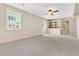 A versatile basement space with neutral carpet, built-in shelving, and ample natural light from a large window at 512 Whilden St, Mount Pleasant, SC 29464