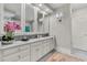 Double vanity bathroom with marble countertop, framed mirrors, and contemporary lighting fixtures at 512 Whilden St, Mount Pleasant, SC 29464