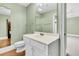 Traditional bathroom with white vanity, mirror, and modern fixtures at 512 Whilden St, Mount Pleasant, SC 29464