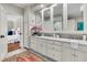 Bathroom features double vanity with marble countertop and framed mirrors, complemented by stylish decor at 512 Whilden St, Mount Pleasant, SC 29464