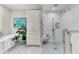 Bathroom with a soaking tub, marble shower, marble floors, and built in storage at 512 Whilden St, Mount Pleasant, SC 29464