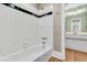 Bathroom featuring a white tiled shower/tub and a vanity at 512 Whilden St, Mount Pleasant, SC 29464